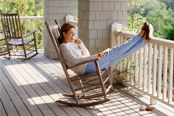 woman in rocking chair on porch