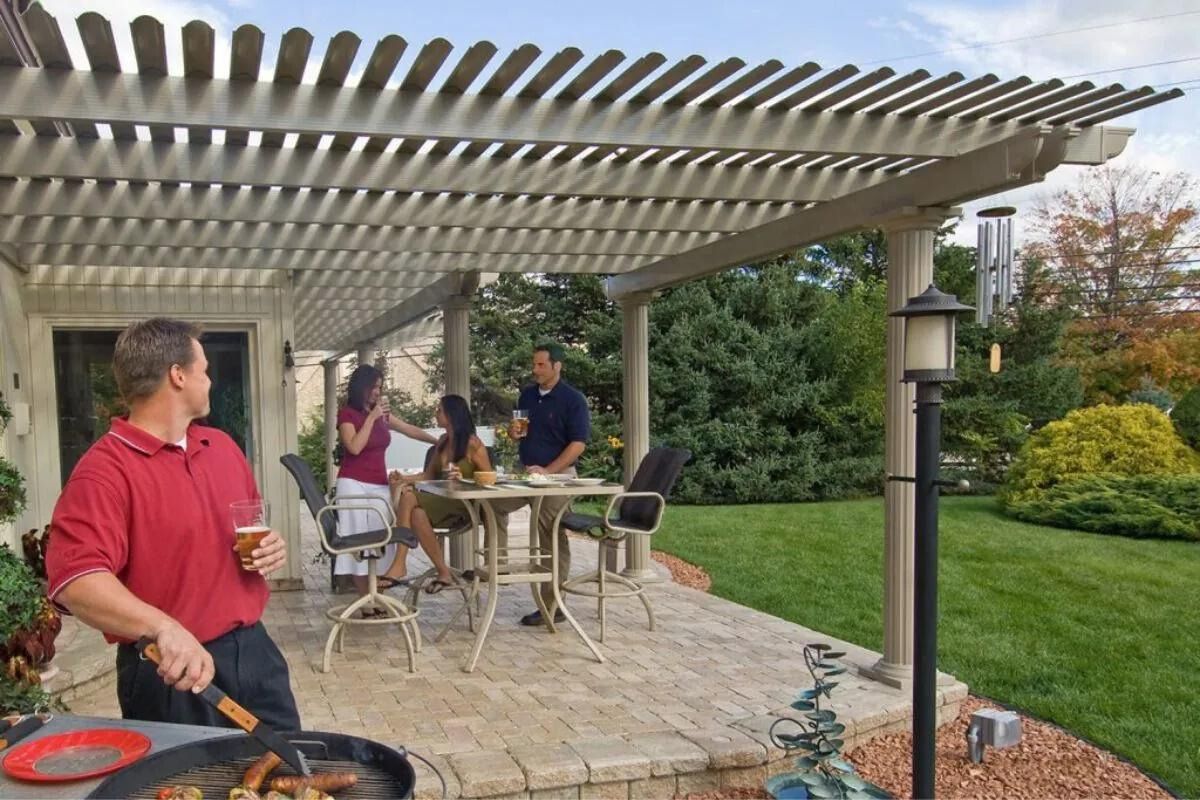 group of friends drinking beer under pergola